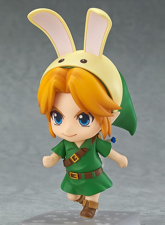 The Nendoroid Link figure wearing the yellow and pink Bunny Hood accessory, posed as if running quickly.