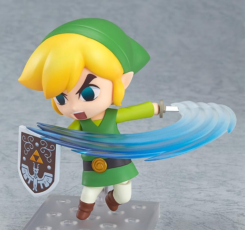 The Nendoroid Link figure in a dynamic action stance, featuring the shouting/combat face plate and the translucent blue sword swing effect part.