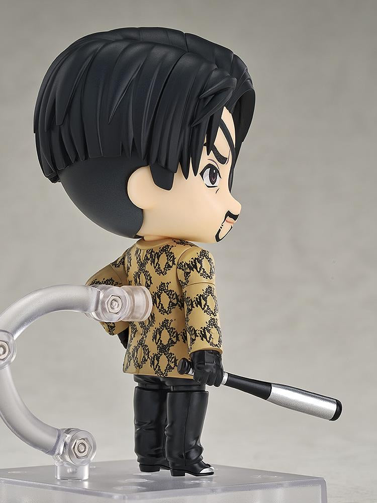 Side profile of the Majima Nendoroid figure, highlighting his hairstyle, eyepatch, and the bat tucked under his arm.