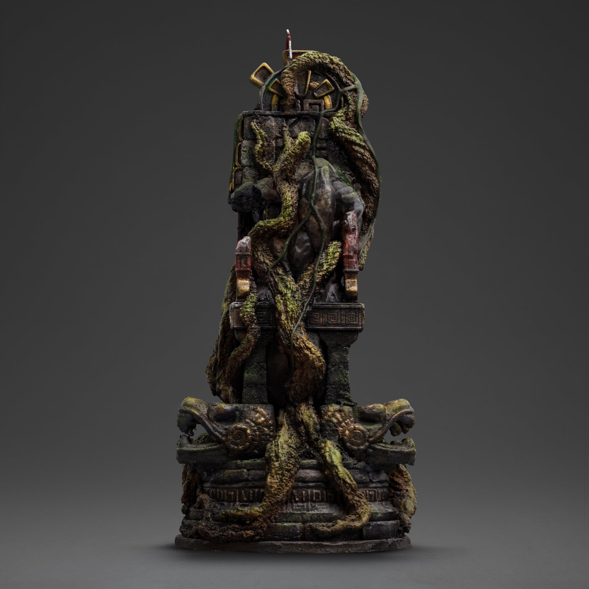 A full rear view of the jungle ruins diorama base on the Lara Croft statue, covered in moss, vines, and intricate stone carvings.