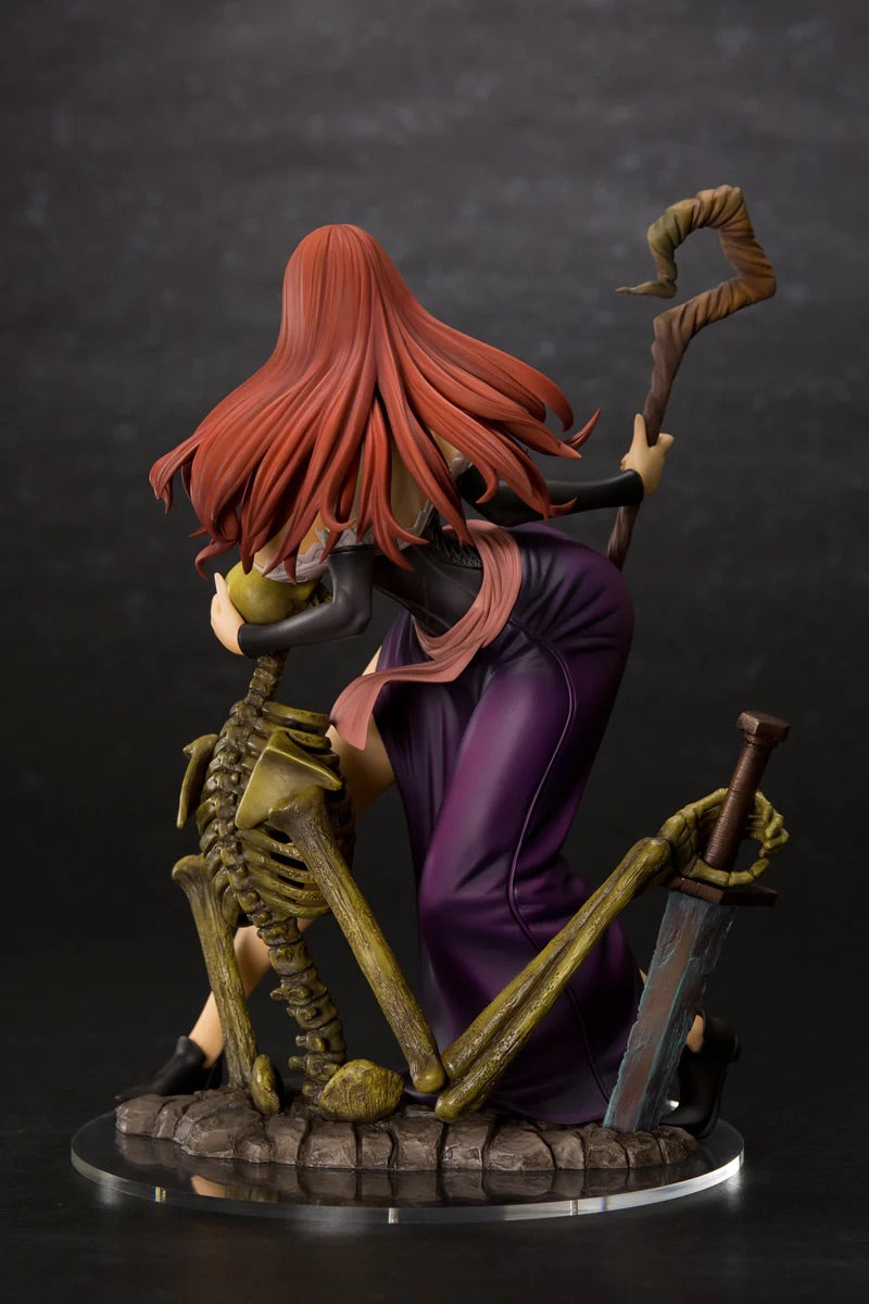 Rear three-quarter view of the Sorceress figure without her hat, showing the deep purple skirt and the cursed sword in the skeleton's hand.