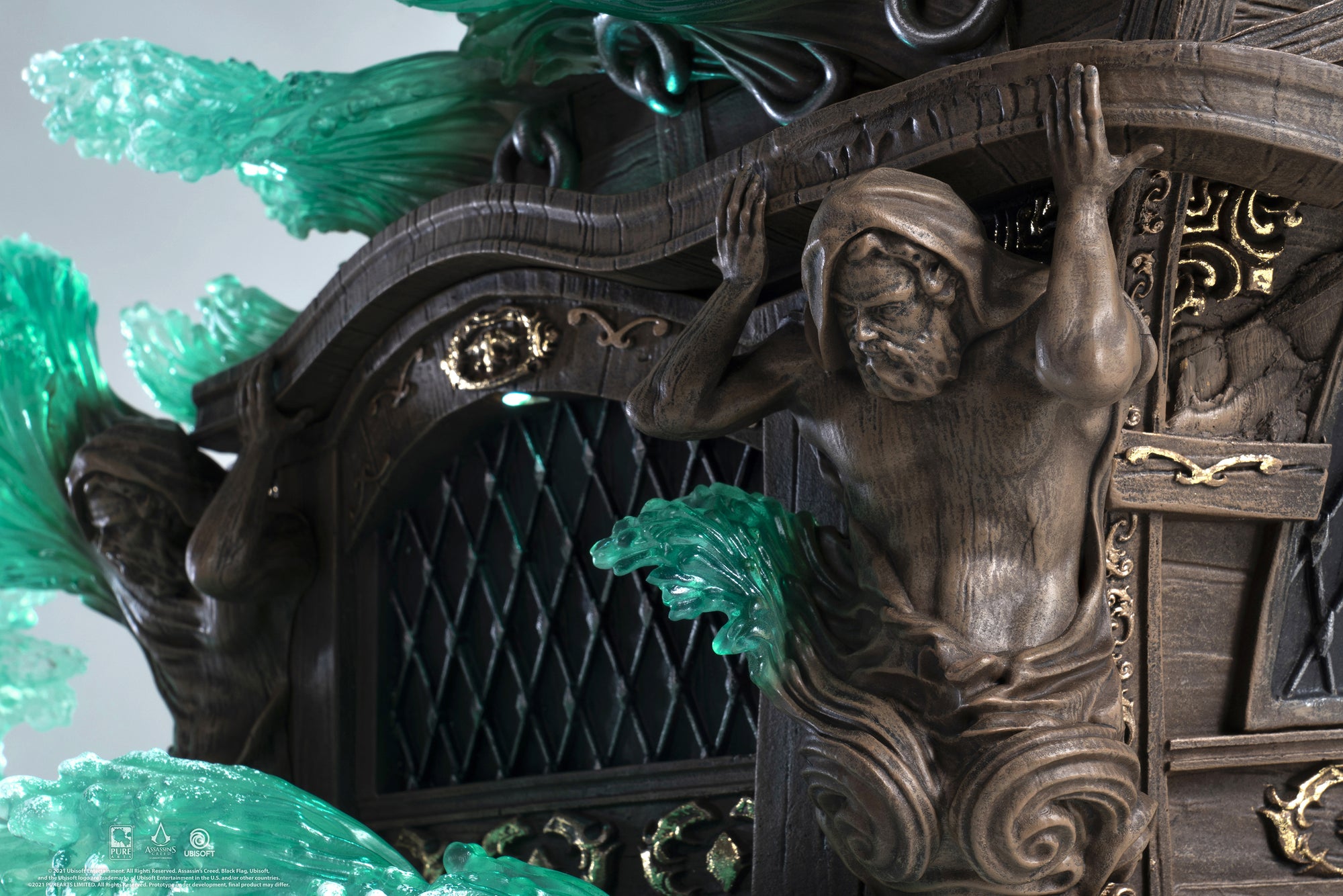 A detailed close-up of the Jackdaw ship base from the Edward Kenway statue, highlighting the sculpted wood grain and the mythological figures on the stern.