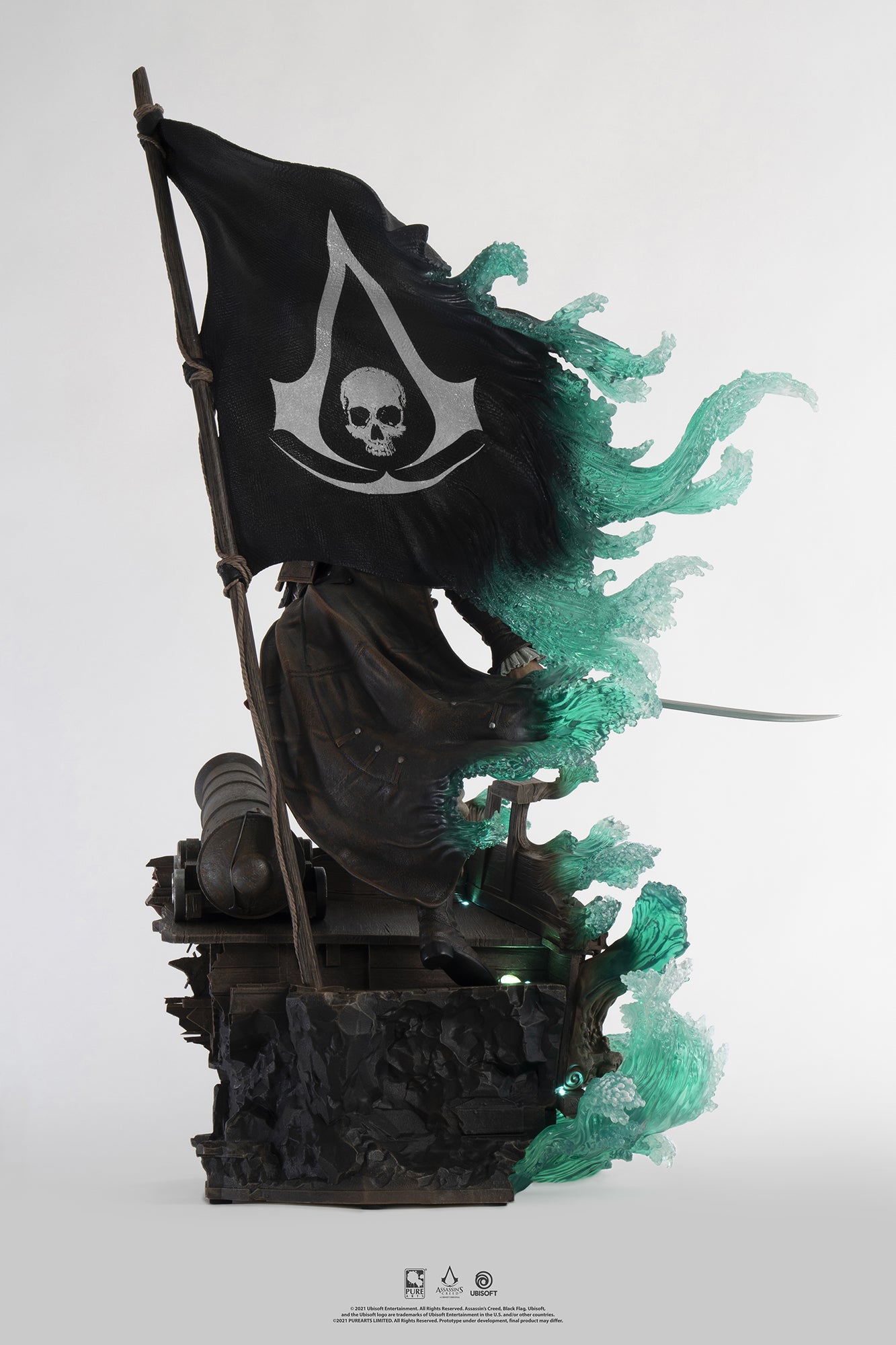 Rear view of the Animus Edward Kenway statue, focusing on the large pirate flag with the Assassin's symbol and the glowing Animus effect behind the figure.