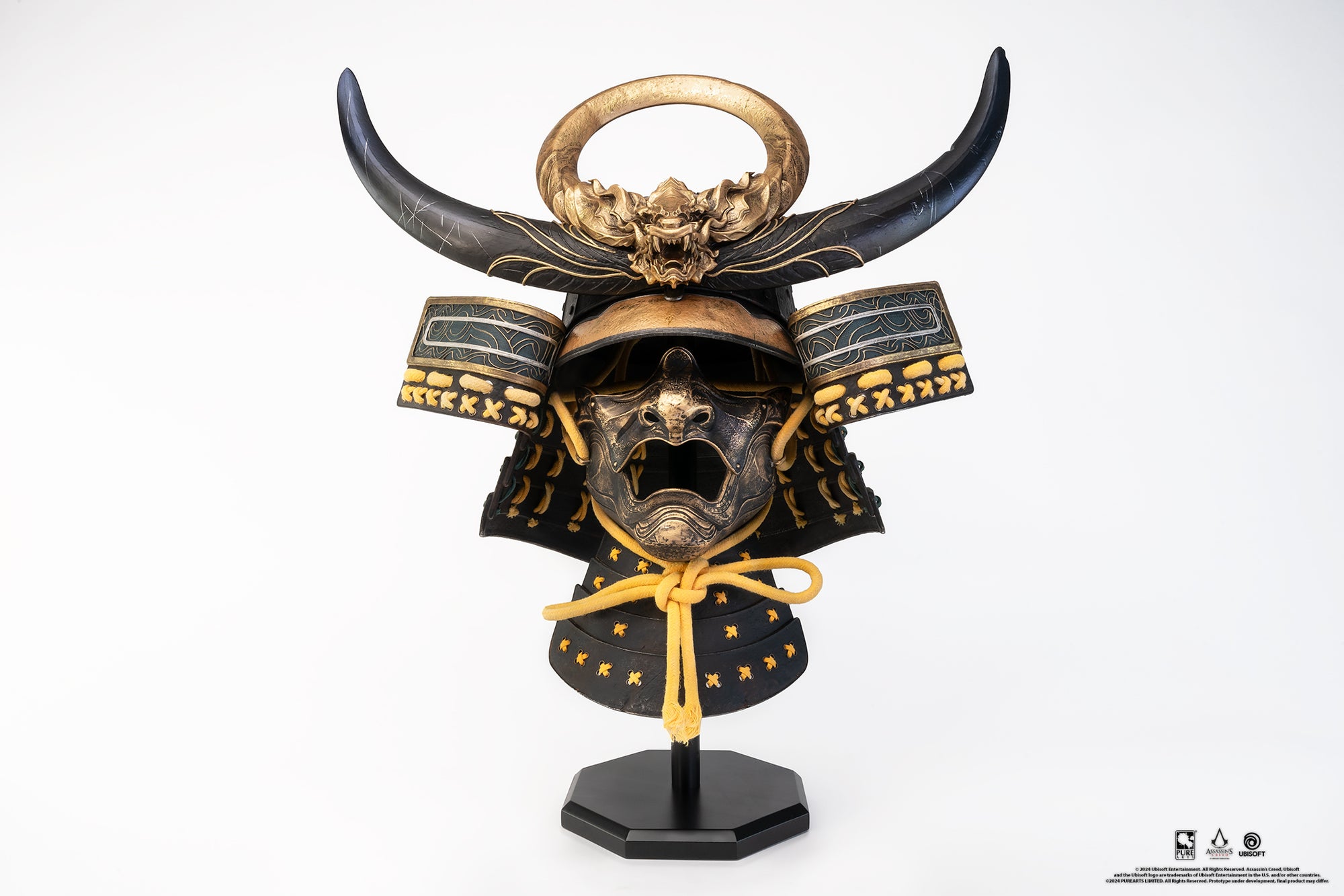 Front view of PureArts Assassin’s Creed Yasuke Samurai Helmet 1/1 Scale Replica with golden dragon crest and black horns.
