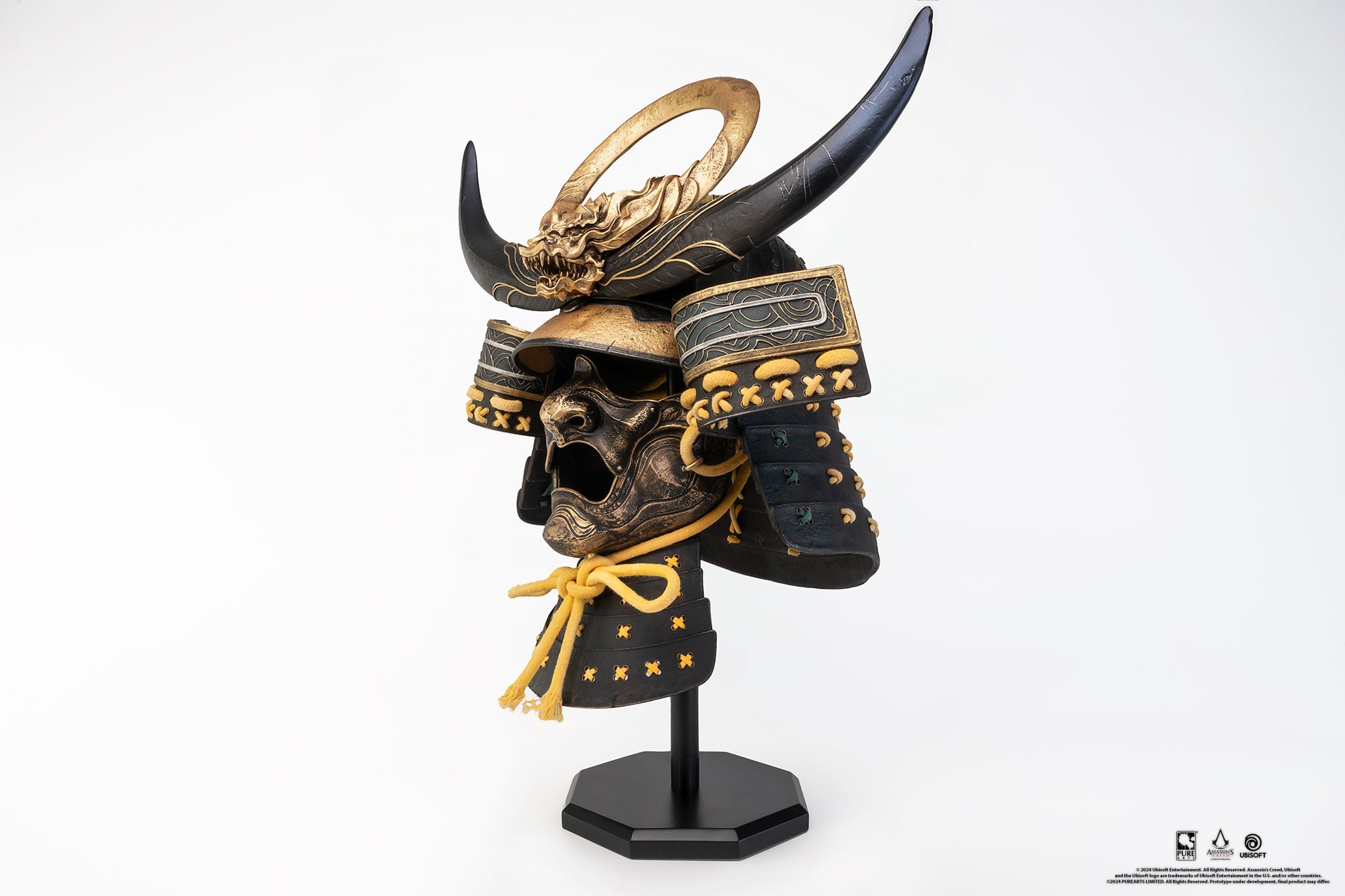 Left side angle of PureArts Assassin’s Creed Yasuke Samurai Helmet life-size replica showcasing detailed mask, horns, and golden accents.
