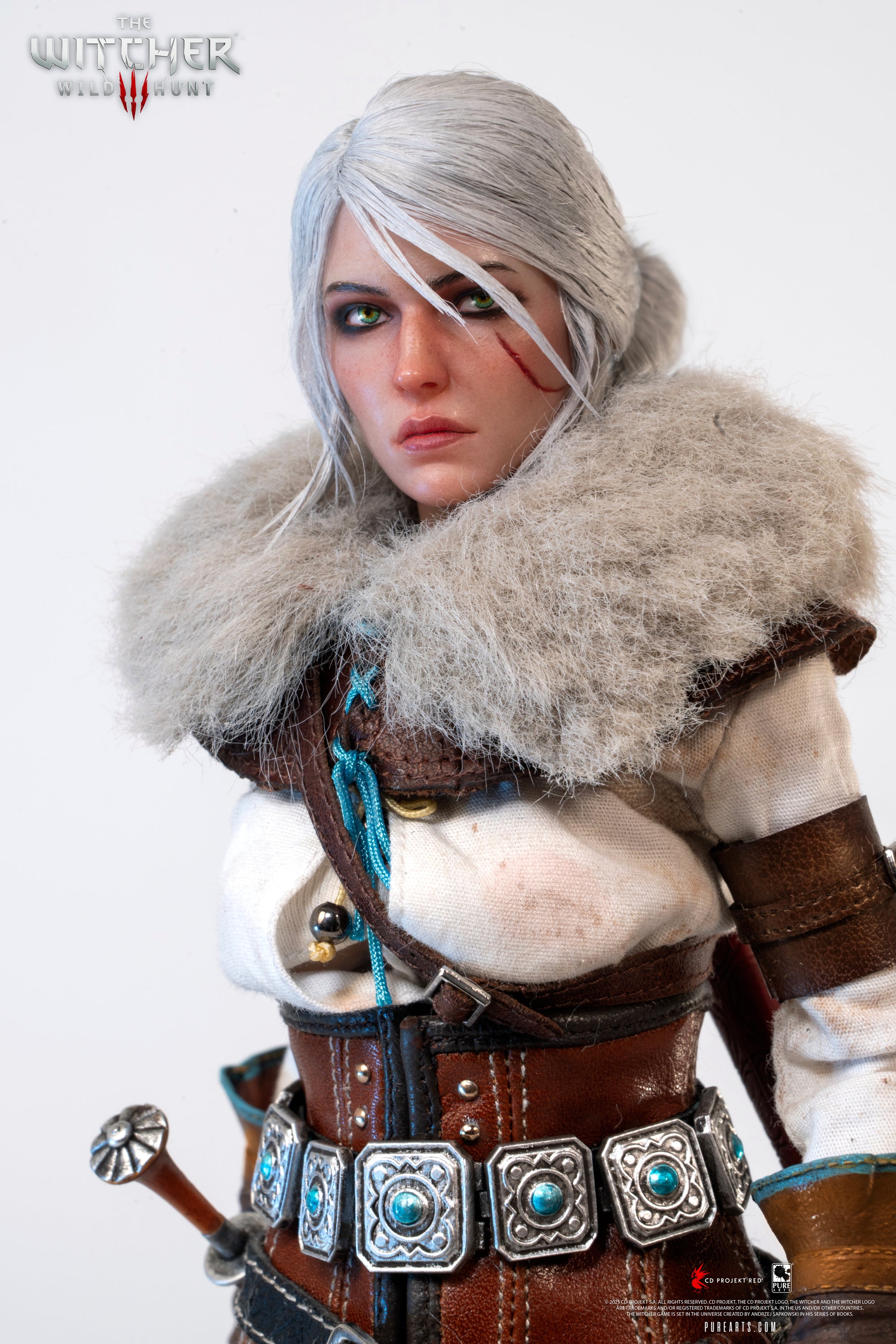 Extreme close-up of Ciri's torso and face, focusing on the turquoise-studded belt and the texture of the fur collar.