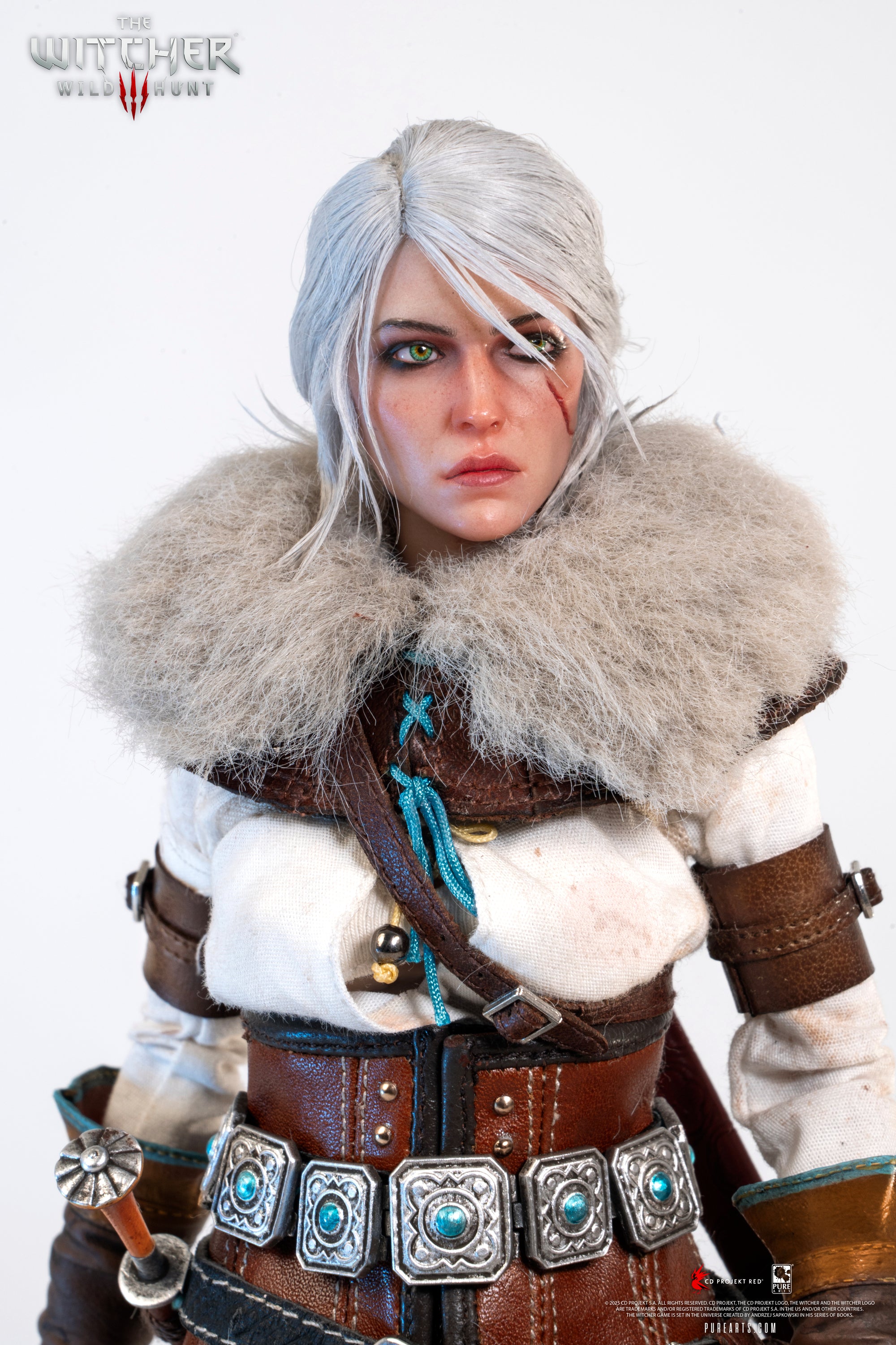 Close-up of the Ciri figure's face, wearing the large faux fur mantle and featuring her signature scar and piercing eyes.
