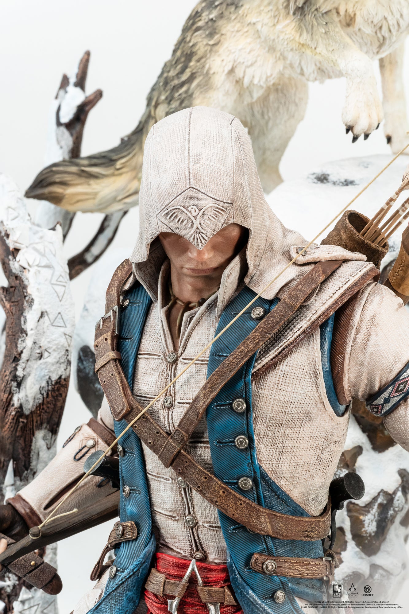 A detailed close-up of Connor's face and hood from the Animus statue, showing the intricate eagle pattern on the hood and the realistic textures of his clothing.