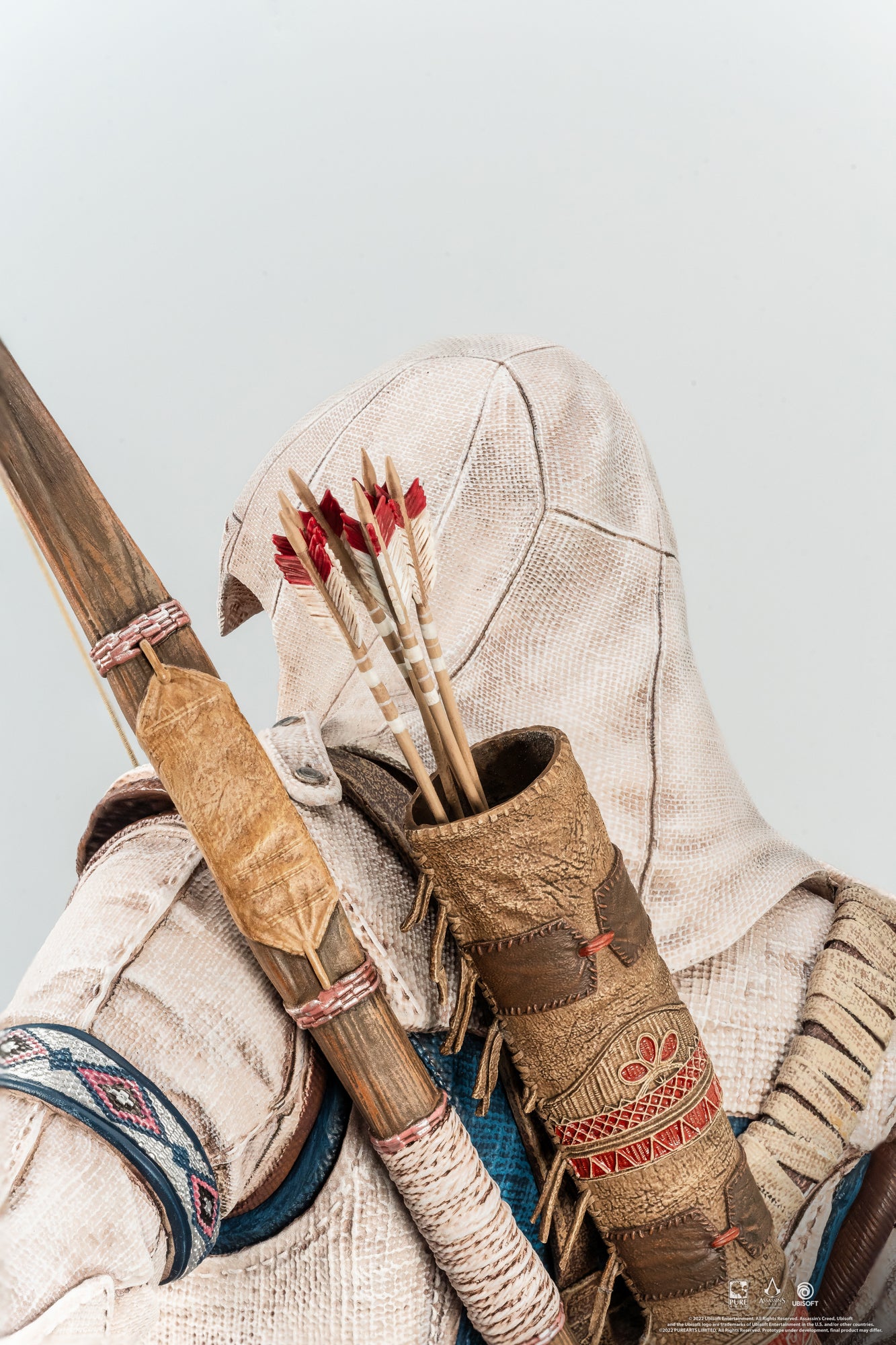 A detailed close-up of the quiver and arrows on the back of the Animus Connor statue, showing the wood texture and feather fletching.