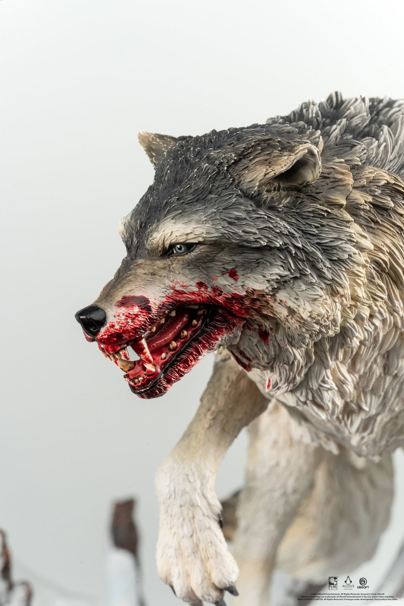 A close-up of the wolf from the Animus Connor statue, highlighting the hyper-realistic sculpt of its face, fur, and teeth covered in blood.