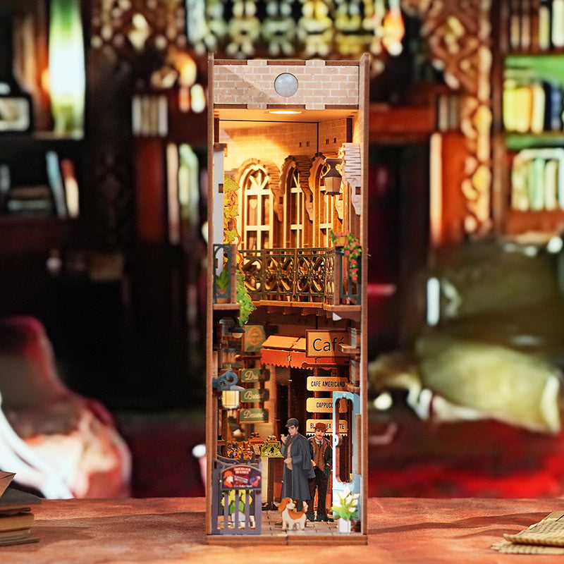 Close-up of the assembled "Baker Street" book nook, displayed with soft focus on the surrounding bookshelf environment.