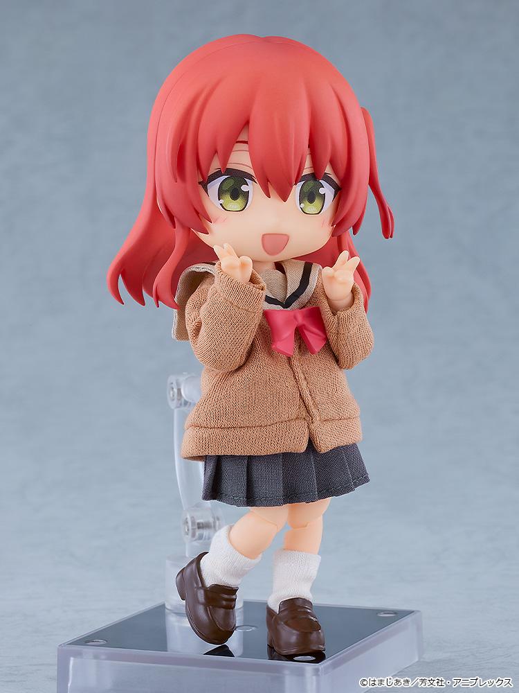 Cheerful Ikuyo Kita Nendoroid Doll figure smiling and flashing double peace signs in her fabric high school uniform outfit.