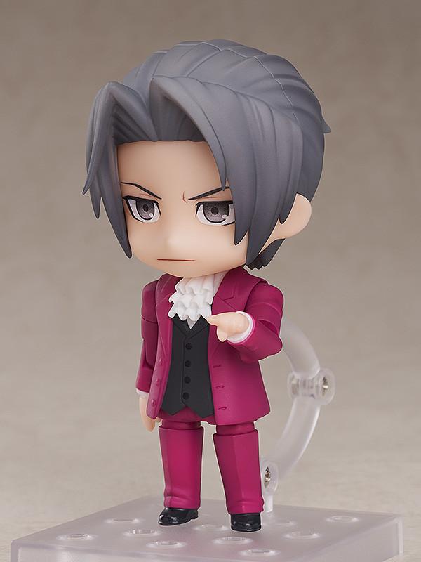 Ace Attorney Miles Edgeworth Nendoroid figure holding a white court document paper on clear stand.