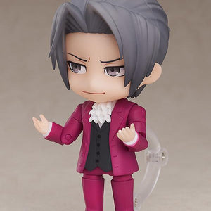 Miles Edgeworth Nendoroid figure pointing forward with serious standard faceplate expression.