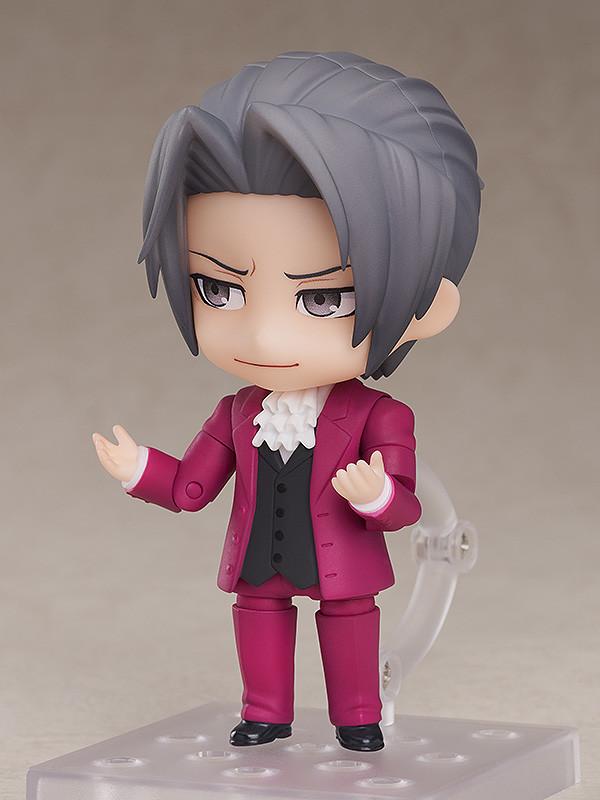 Miles Edgeworth Nendoroid figure pointing forward with serious standard faceplate expression.