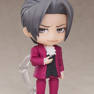 Ace Attorney Miles Edgeworth Nendoroid figure displaying smug smile faceplate with open hand gesture.
