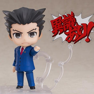 Phoenix Wright Nendoroid figure pointing finger with Japanese Objection text plate on clear stand.