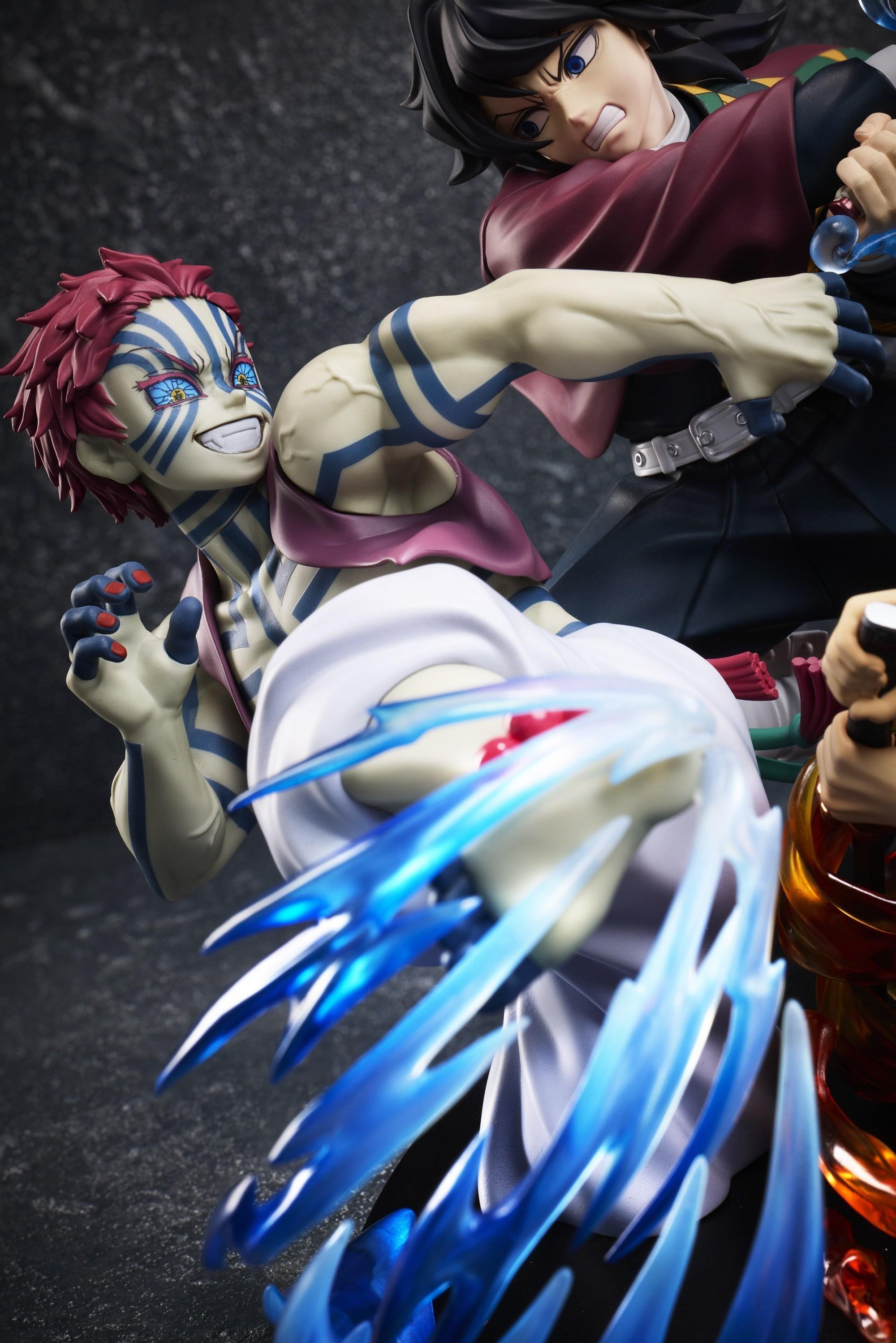 High-angle detail shot of Akaza smiling with martial arts leg effect next to Giyu Tomioka