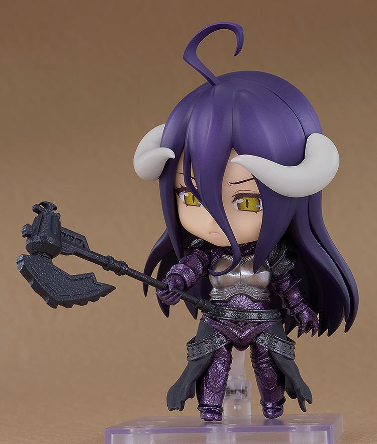 Three-quarter angle of the Albedo armor version Nendoroid Basic figure dynamically posing with her large black battle axe halberd extended forward.