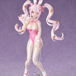 Playful pose of the Alice bunny figure with a winking face plate and hand near her mouth.