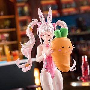 Close-up of the Alice: Wonderland Bunny figure hugging a plush carrot accessory with a happy facial expression.