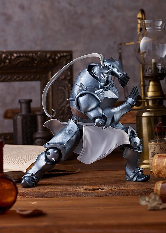 Alphonse Elric armor figure displayed on a wooden desk with alchemy props, capturing the Fullmetal Alchemist: Brotherhood aesthetic.