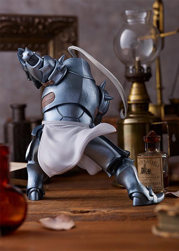 Rear view of the Alphonse Elric armor figure showing the intricate plating, leather straps, and white cloth detail.