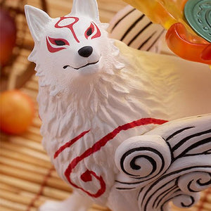 Close-up three-quarter portrait of the Amaterasu wolf figure, highlighting the matte white fur texture finish and premium paint applications on the facial features.