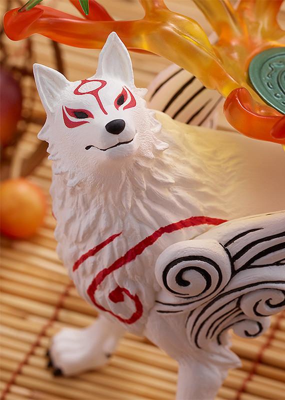 Close-up three-quarter portrait of the Amaterasu wolf figure, highlighting the matte white fur texture finish and premium paint applications on the facial features.