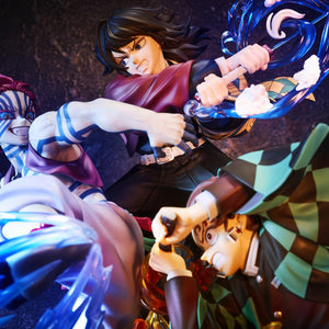 Dynamic low-angle view of Tanjiro, Giyu Tomioka, and Akaza figure under dramatic purple battle lighting