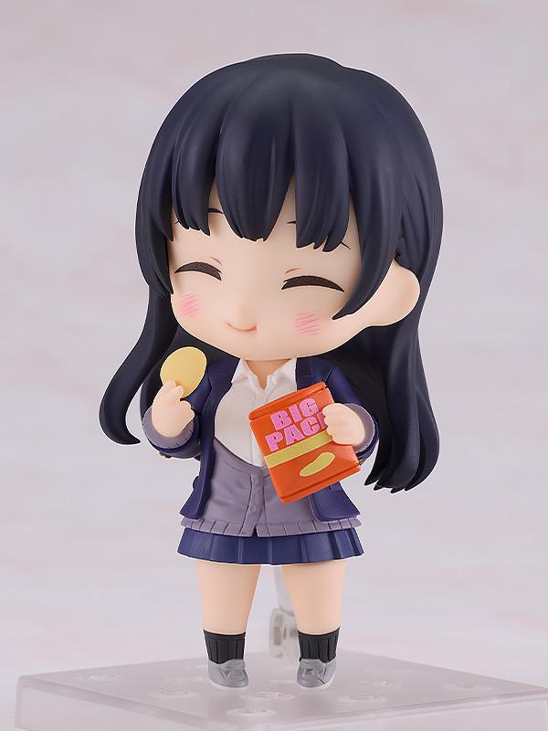 Anna Yamada Nendoroid with a content eating face plate, holding a "Big Pack" potato chip bag and a single chip accessory.