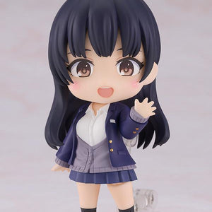 Anna Yamada Nendoroid in a cheerful waving pose on a clear display stand, wearing her signature blue school blazer and grey cardigan.