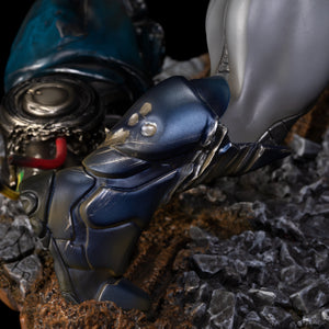 An extreme close-up of the leg and foot armor on the Apocalypse statue, showing the intricate metallic blue and gray details on the polystone figure.