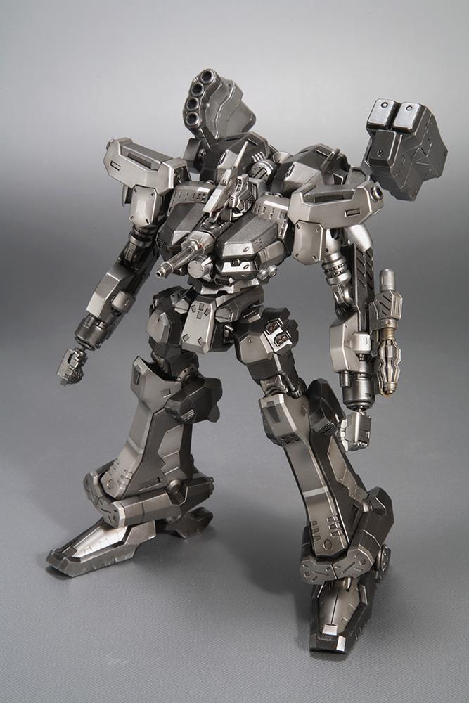 High-angle three-quarter front studio shot of the Crest CR-C90U3 model kit, emphasizing the intricate detailing on the chest armor piece and head sensors.
