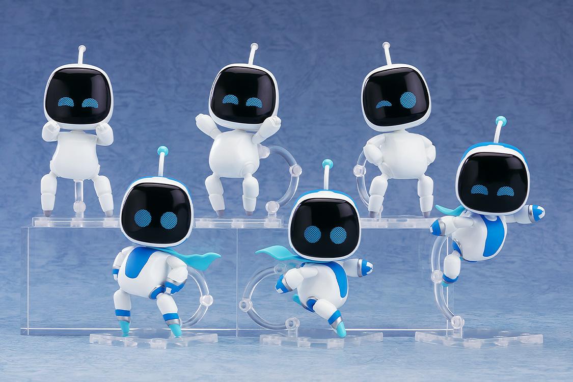 A collection of six Astro Bot Nendoroid Surprise figures mounted on clear plastic stands and tiered display bases against a blue background.