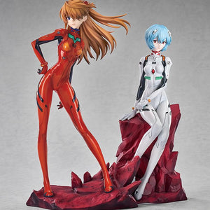 Display showing the Asuka Shikinami Langley figure standing next to a seated Rei Ayanami figure on a red rocky base.