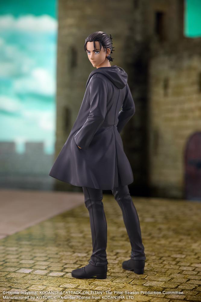 Full body diorama shot of the Eren Yeager figure posed on cobblestones in front of a stone fortress backdrop