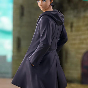 Upper body diorama view of the Kotobukiya Eren Yeager figure set against a blurred stone castle background