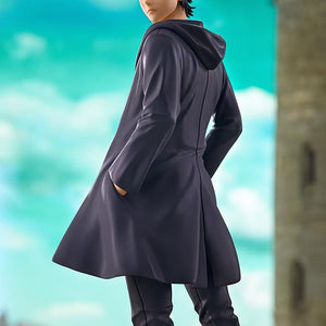 Dramatic diorama shot of Eren Yeager looking over his shoulder against a bright blue sky and castle wall backdrop