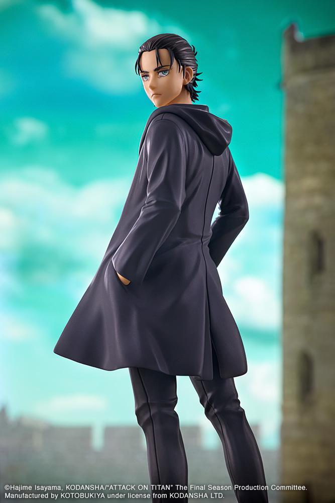 Dramatic diorama shot of Eren Yeager looking over his shoulder against a bright blue sky and castle wall backdrop