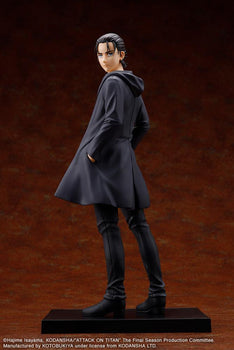 Full length back angle of the Kotobukiya Attack on Titan: The Final Season Eren Yeager Oshi Works figure looking over his shoulder in a long black coat