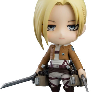 Jean Kirstein Nendoroid figure with goading smirk expression posed beside Eren Yeager Nendoroid figure.