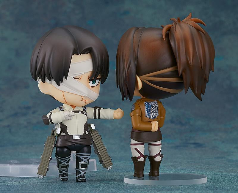 Nendoroid Levi Ackerman figure displayed side-by-side with another figure (Hange), showing the back of the Survey Corps uniform.
