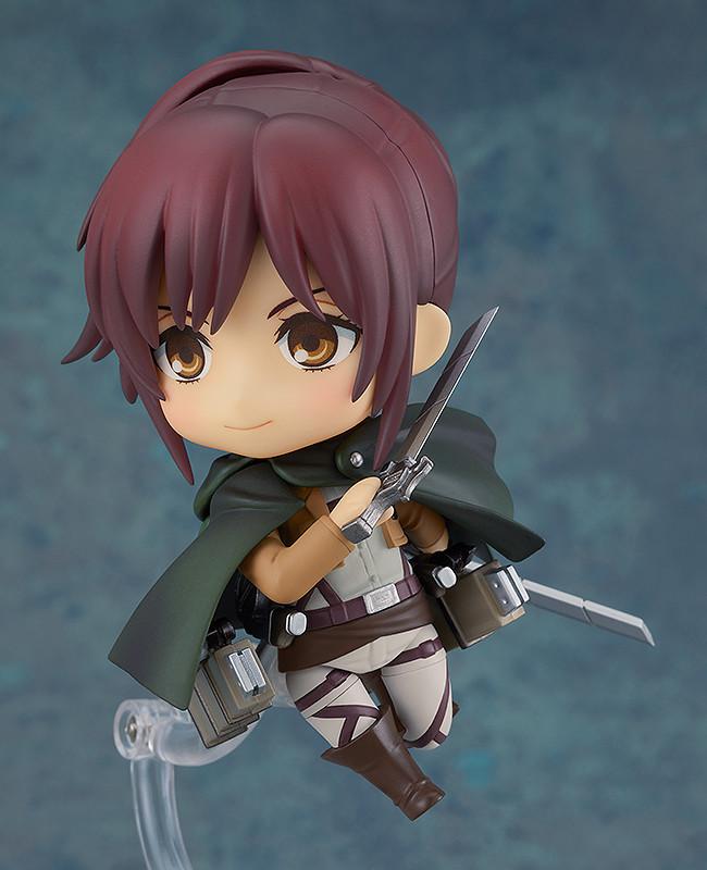 Sasha Braus Nendoroid figure standing on clear display stand with Survey Corps cloak and dual blades.