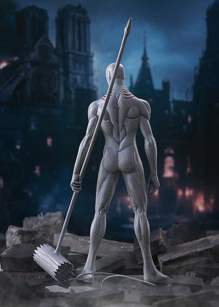 Back view of the War Hammer Titan figure, highlighting the detailed muscle definition, the skin texture, and the war hammer weapon resting on the ground.