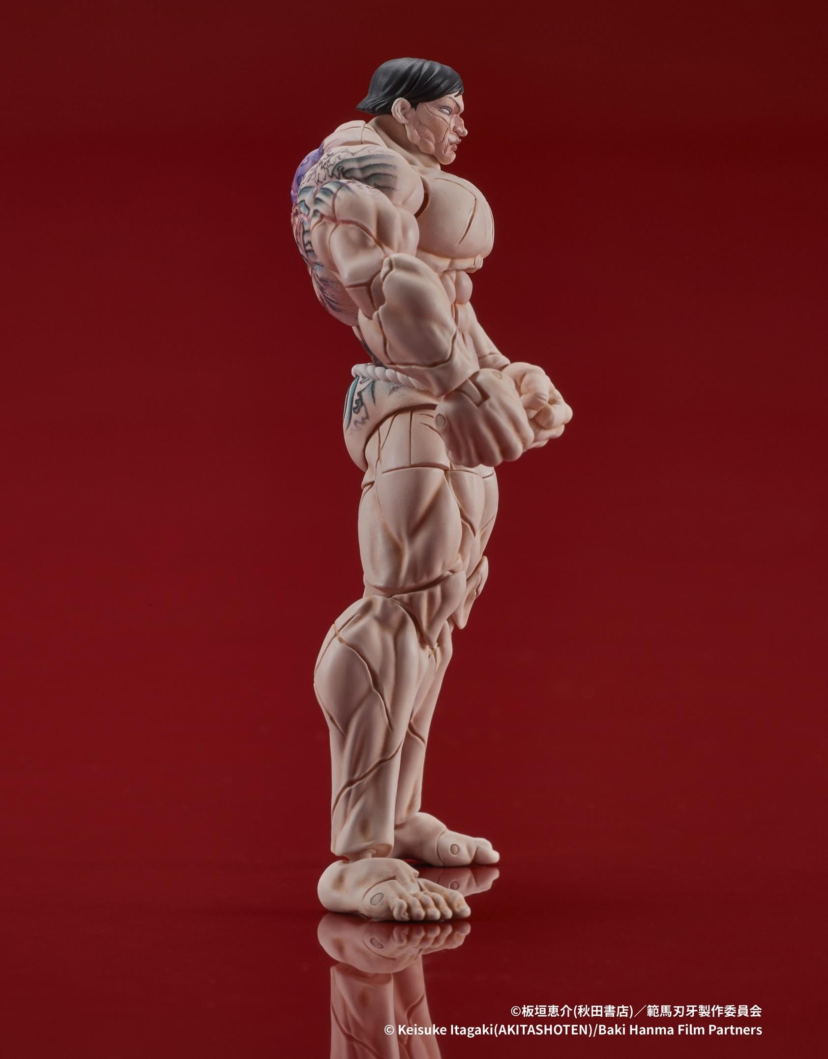 Side view highlighting the articulation points and muscle sculpt of the Hanayama figure.