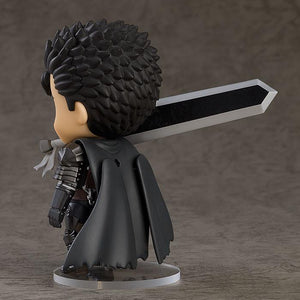 Berserk Guts Nendoroid figure with a berserk grinning face plate wielding the Dragon Slayer sword in a dynamic action pose