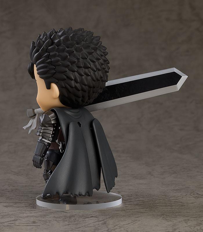 Berserk Guts Nendoroid figure with a berserk grinning face plate wielding the Dragon Slayer sword in a dynamic action pose