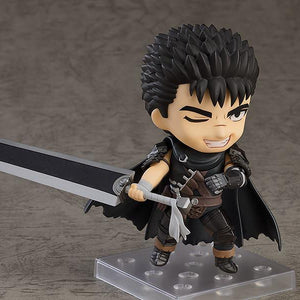Guts Nendoroid figure from Berserk aiming his mechanical prosthetic cannon arm forward in an action pose