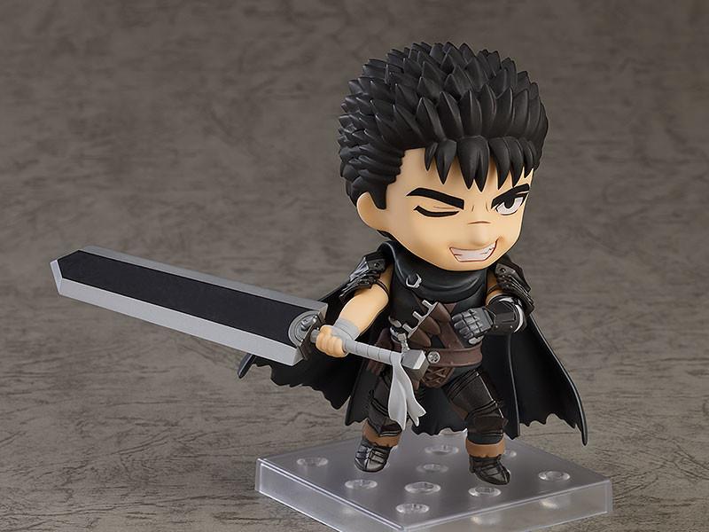 Guts Nendoroid figure from Berserk aiming his mechanical prosthetic cannon arm forward in an action pose